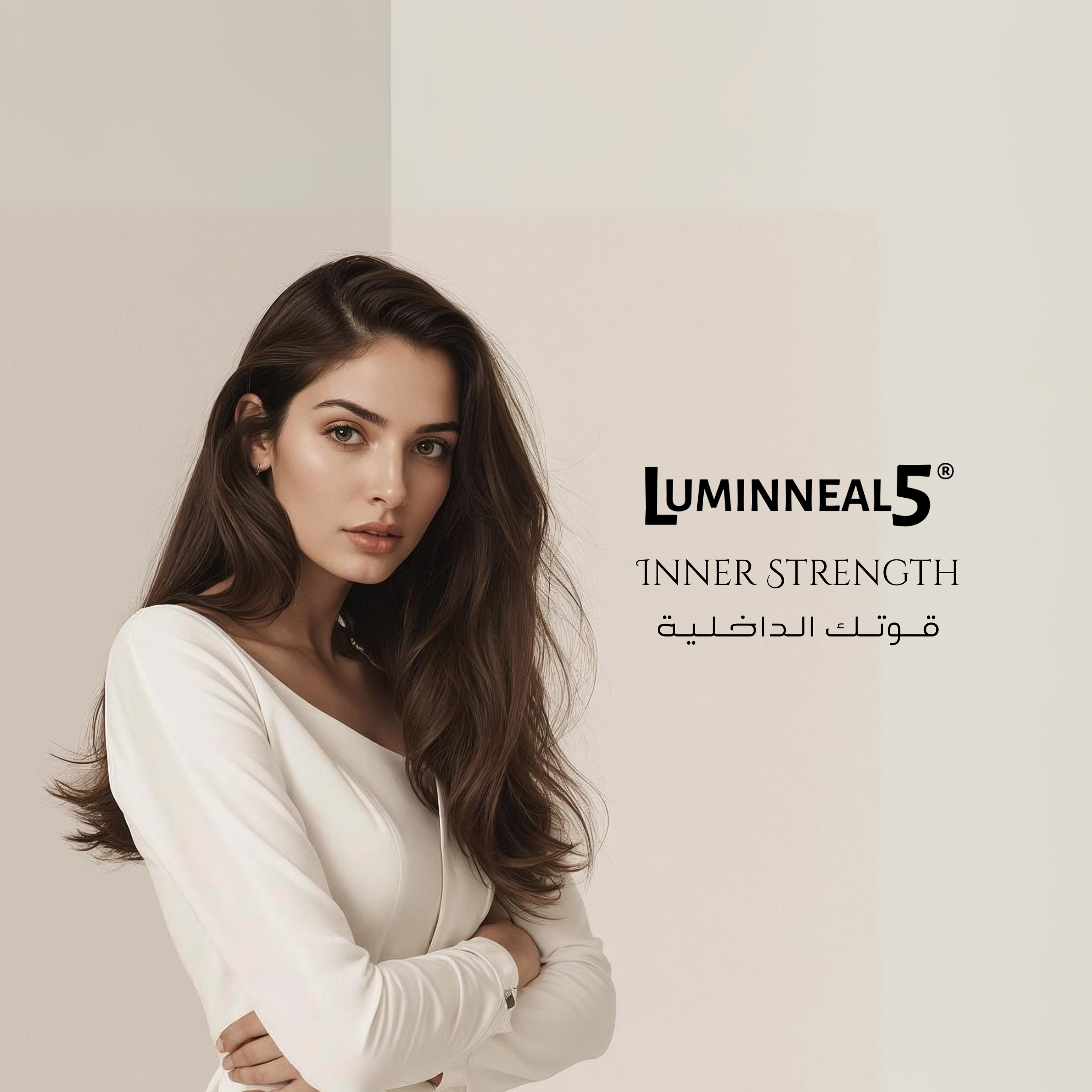 Woman with long hair wearing a white top, standing against a plain background with Luminneal5 branding.